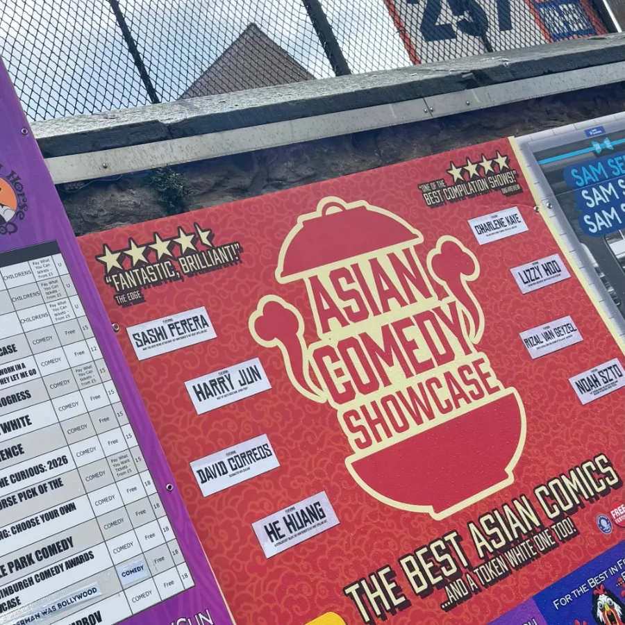 The red Asian Comedy Showcase banner, listing featured comedians, beside a Laughing Horse listings board